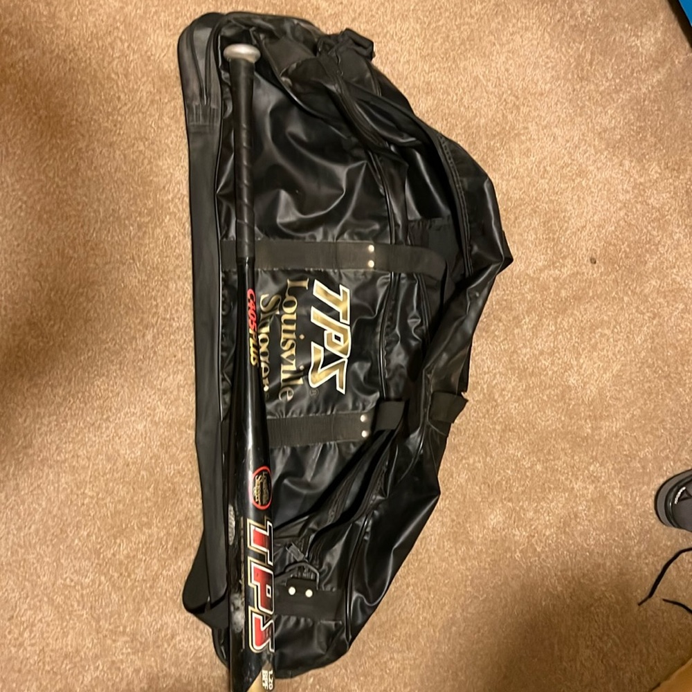 Softball bat and bag.